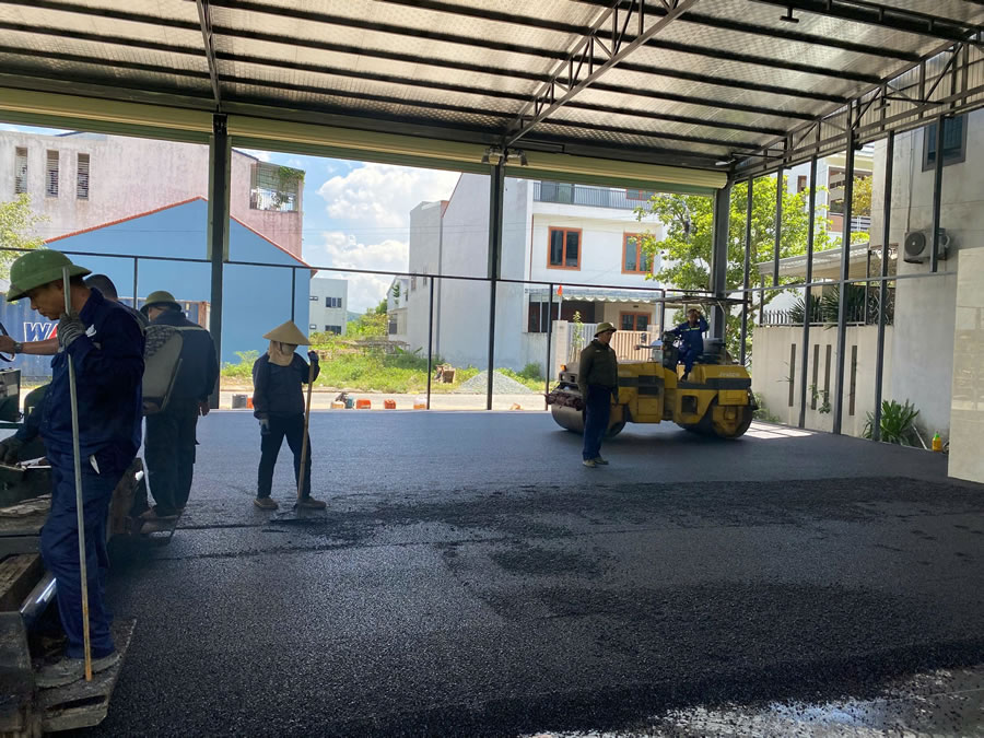 Thi công trải bê tông nhựa đường bê tông trong nhà kho